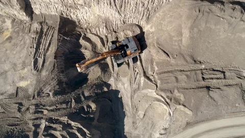 Digging Deep: Aerial Footage of a Backhoe at a Quarry Stock Footage 236574092