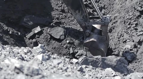 Digging by an excavator and loading a dump track in open pit Stock Footage 45798796