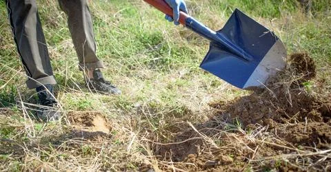 Digging in the ground for gardening or construction work Stock Photos
