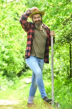 Digging ground for plant seeding. man with spade digging garden bed or farm Stock Photos