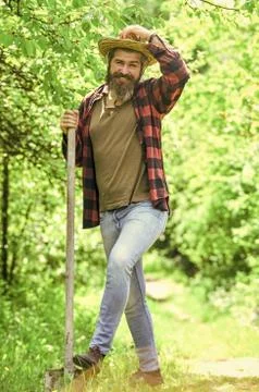 Digging ground for plant seeding. man with spade digging garden bed or farm Stock Photos