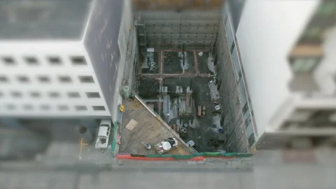 Digging a hole to build an apartment block Stock Footage 158067011