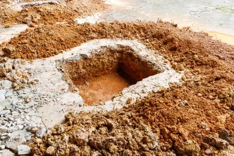 Digging hole on concrete floor Stock Photos
