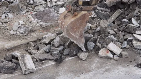 Digging Machine bucket moving debris Video stock 139978151