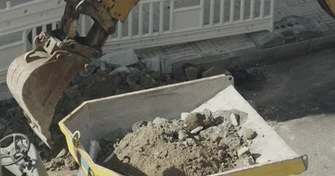Digging Machine loading debris in a dumper Video stock 141149309