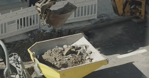 Digging Machine loading debris in a dumper Video stock 141151328