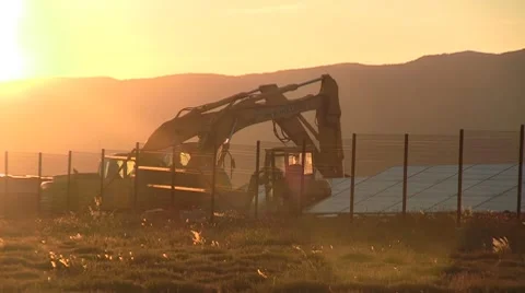 Digging machine at sunset Stock Footage 8679325