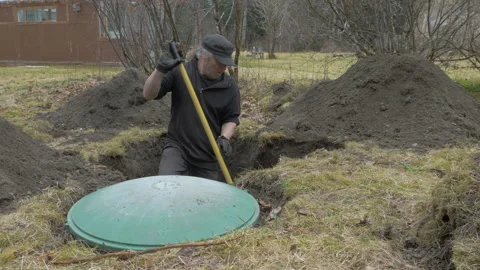 Digging Out Septic Tank in Yard in Autumn Stock Footage 233387209