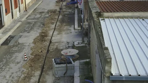Digging a restricted section for buried corrugated plastic conduits to run fi Video stock 146263104