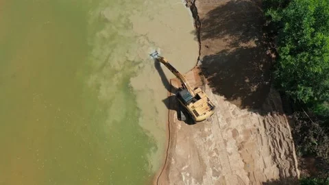 Digging up river bank Stock Footage 132246776