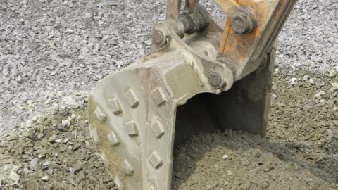 Digging in Rock - A Closer Look at Crane Diggers in Action Stock Footage 324068434