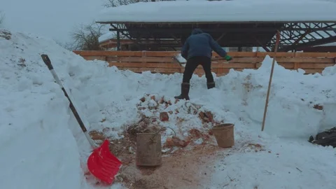 Digging snow with a shovel, clearing the path of snow Stock Footage 329069811