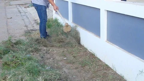 Digging the soil with a hoe to make the garden ready Stock Footage 71262008