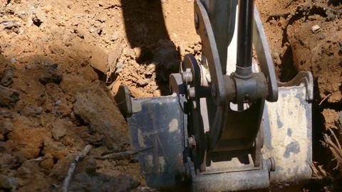 Digging a trench with a backhoe - close-up 4K Видео 93748813