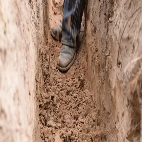Digging a trench with a spade Stock Footage 69441105