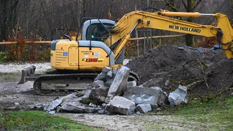 Digging water with bulldozers hand Stock Footage 168283893