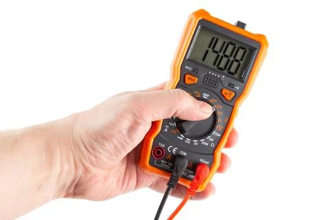 Digit 1488 on lcd screen of digital electrical multimeter in left hand, isola Stock Photos
