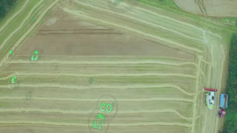 Digital agriculture animating over tractor pulling trailer with farmers and Stock Footage 308206937