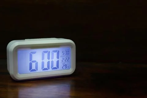 Digital alarm clock 6:00 close up image. Stock Photos