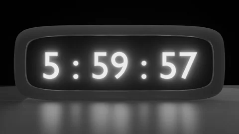 Digital alarm clock with black and white clockface waking up at 6 AM. The Video stock 258660268