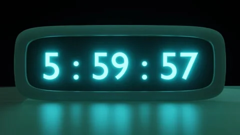 Digital alarm clock with cyan clockface waking up at 6 AM. The numbers on the Video stock 259058235