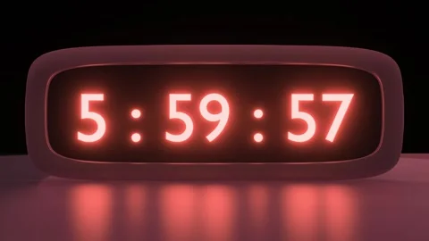 Digital alarm clock with orange clockface waking up at 6 AM. The numbers on the Video stock 260920570