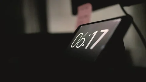 Digital alarm clock seen close up on the table Stock Footage 289696138