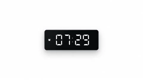 Digital alarm clock switching from seven twenty nine to seven thirty 7.30. 4K 스톡 동영상 343265047