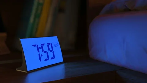 Digital alarm clock waking up at 8 AM Stock Footage 93305660