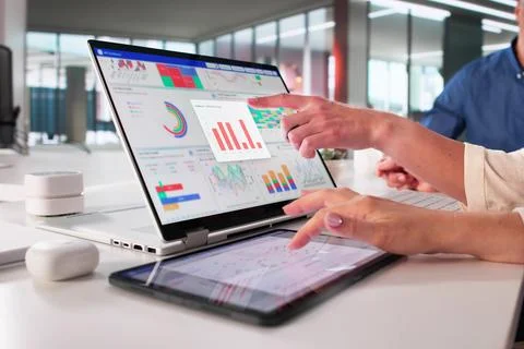 Digital Analytics Team Analyzing Business Data On Interactive Tablet Dashboar Stock Photos