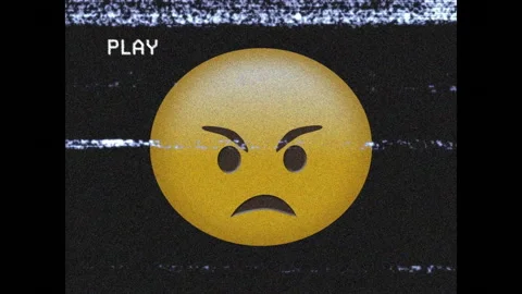 Digital animation of VHS glitch effect over angry face emoji Stock Footage 341421543