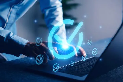 Digital approval concept with glowing checkmark icon on laptop screen, repr.. Foto stock