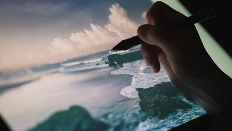 Digital artist edit his artwork photography on interactive tablet computer Stock Footage 103544822