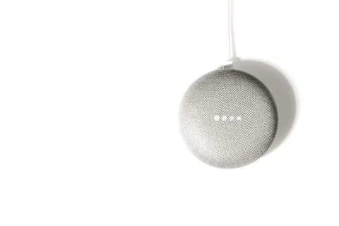 Digital Assistant concept. Flat lay of smart speaker with LED lights activated Stock Photos