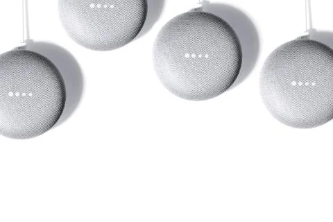 Digital Assistant concept. Flat lay of smart speakers with LED lights activated Stock Photos