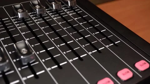 The digital audio mixer is self-configuring. The switches move on their own on Stock Footage 233042960