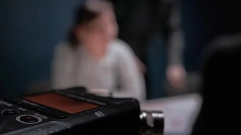 Digital audio voice recorder, blinking record button, close up. Interrogation by Stock Footage 255634056