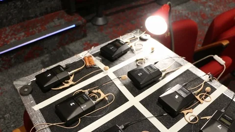 Digital AV equipment, wireless mics for an event, setup on flight case Stock Footage 98684781