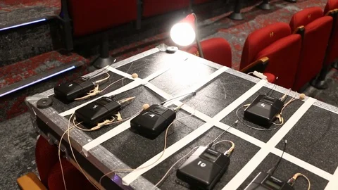 Digital AV equipment, wireless mics for an event, setup on flight case Stock Footage 98684949