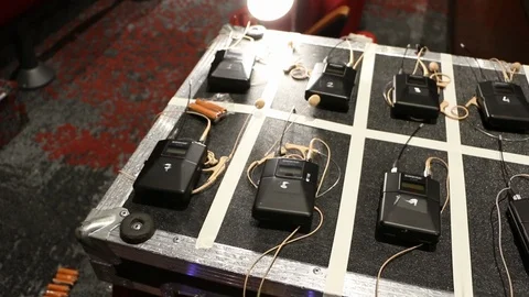 Digital AV equipment, wireless mics for an event, setup on flight case Stock Footage 98685336