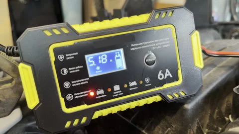 Digital Battery Charger Powers Car Battery Inside Engine Bay Stock Footage 336863927