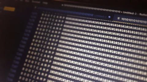 Digital binary code data on computer screen. Hacker concept background. 写真素材