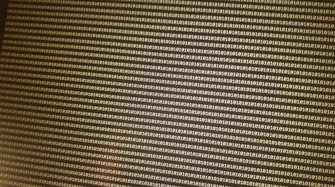 Digital binary code data on computer screen. Hacker concept background. Stock Photos