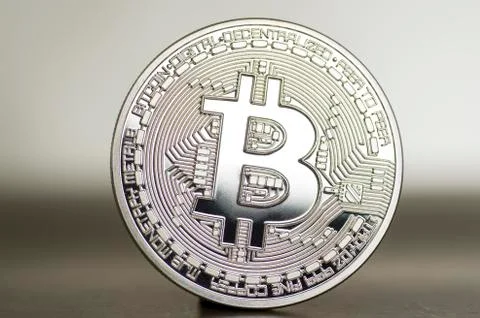 Digital bitcoin on a bronze background. Background. Stock Photos