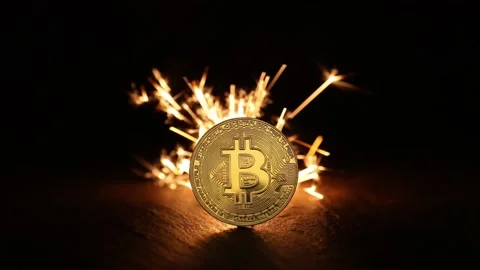 Digital bitcoins with fire sparks in the back Stock Footage 220933513