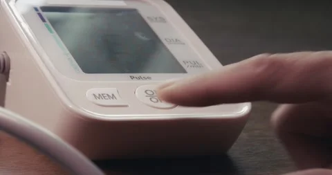 Digital Blood Pressure Device Activated by Finger Touch During Home Routine Stock Footage 345410660