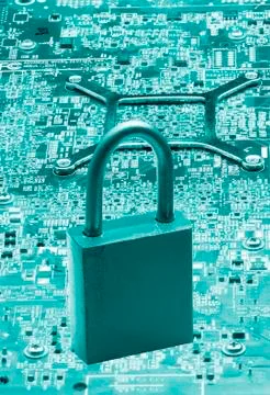 On the digital board is a lock from hacking a symbol of reliability Stock Photos