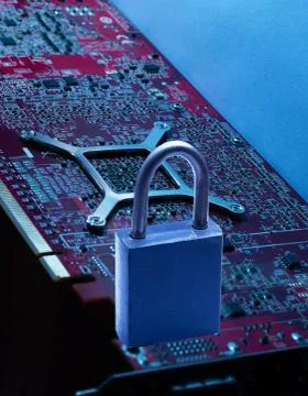 On the digital board is a lock from hacking a symbol of reliability Stock Photos