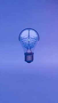 Digital brain glowing inside light bulb over purple background 写真素材