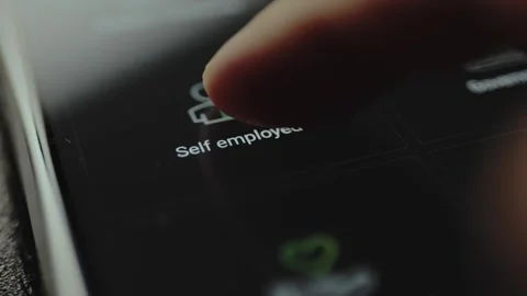 Digital button labeled Self employed on a screen Stock Footage 328376071